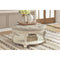 Realyn - White/Brown - Ottoman Cocktail Table-Washburn's Home Furnishings