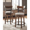 Ashley Valebeck - Brown - UPH Swivel Barstool (1/CN)-Washburn's Home Furnishings