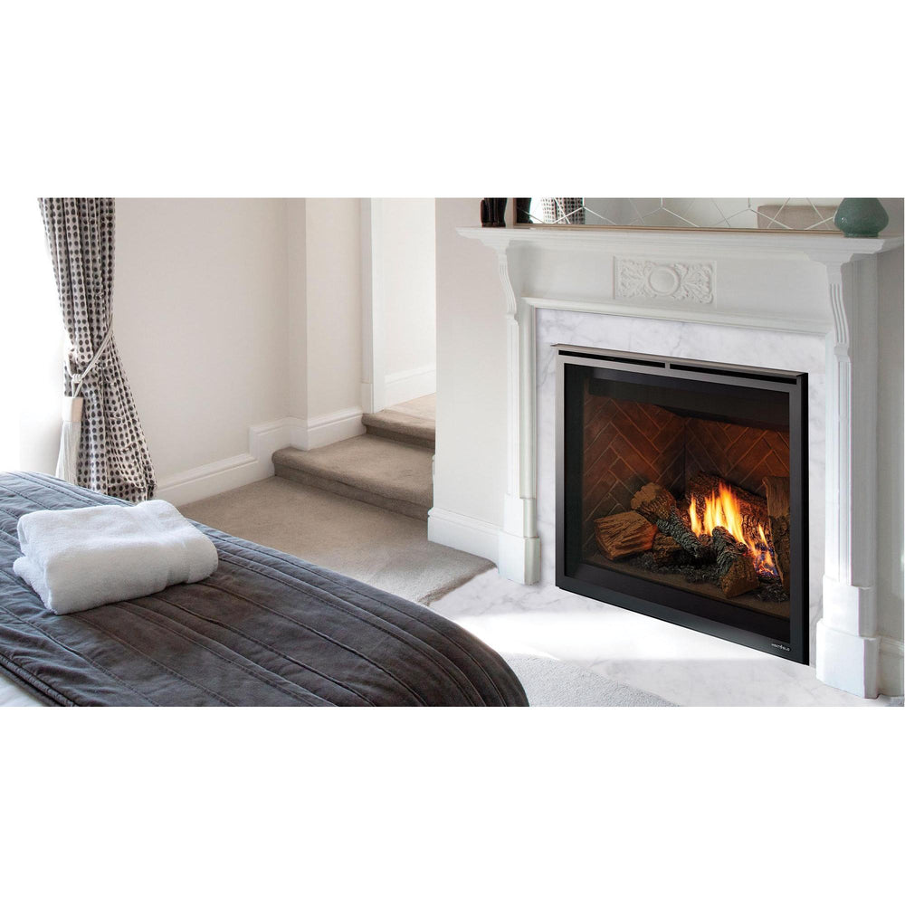 Traditional gas fireplace in white mantel warms up bedroom with king bed and natural light through windows with sashed drapes. — official 6K/8K Series Traditional Gas Fireplace series image; may show a different size and separately selected options