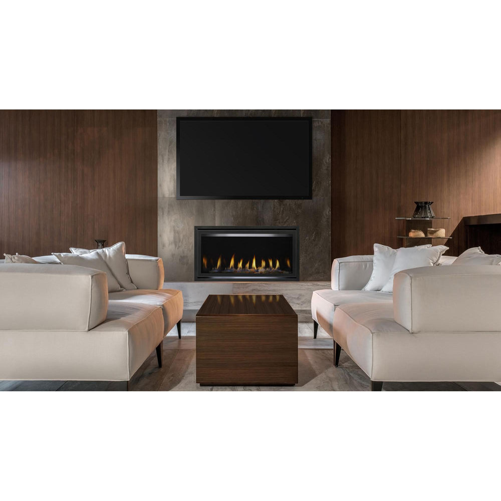 Heat & Glo Cosmo 36" linear indoor gas fireplace on gray stone wall with TV above in modern living room. — official Cosmo Linear Gas Fireplace series image; may show a different size and separately selected options