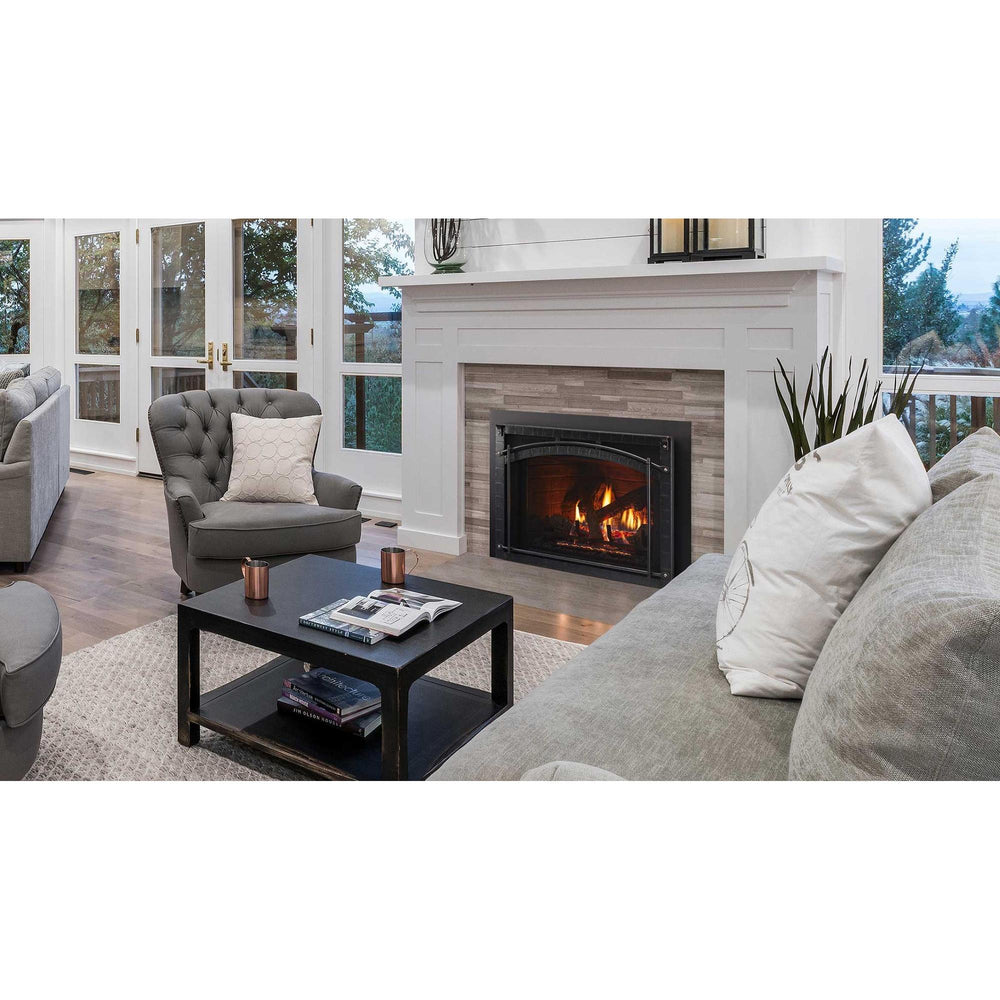 Heat & Glo Escape 30Ó gas fireplace insert with Chateau Forge front in living room.. Official series image; size, front and optional finishes may differ from the quoted configuration.