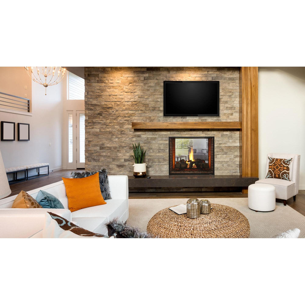 Heat & Glo Escape See-Through gas fireplace in stone wall with wood mantel and TV overhead in living room. — official Escape See-Through Gas Fireplace series image; may show a different size and separately selected options