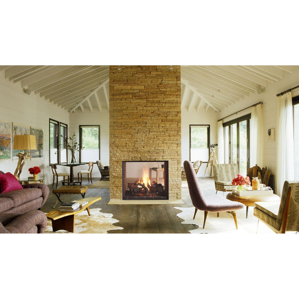 Heat & Glo Escape See-Through gas fireplace with live flames and fire-screen front connecting two rooms. — official Escape See-Through Gas Fireplace series image; may show a different size and separately selected options