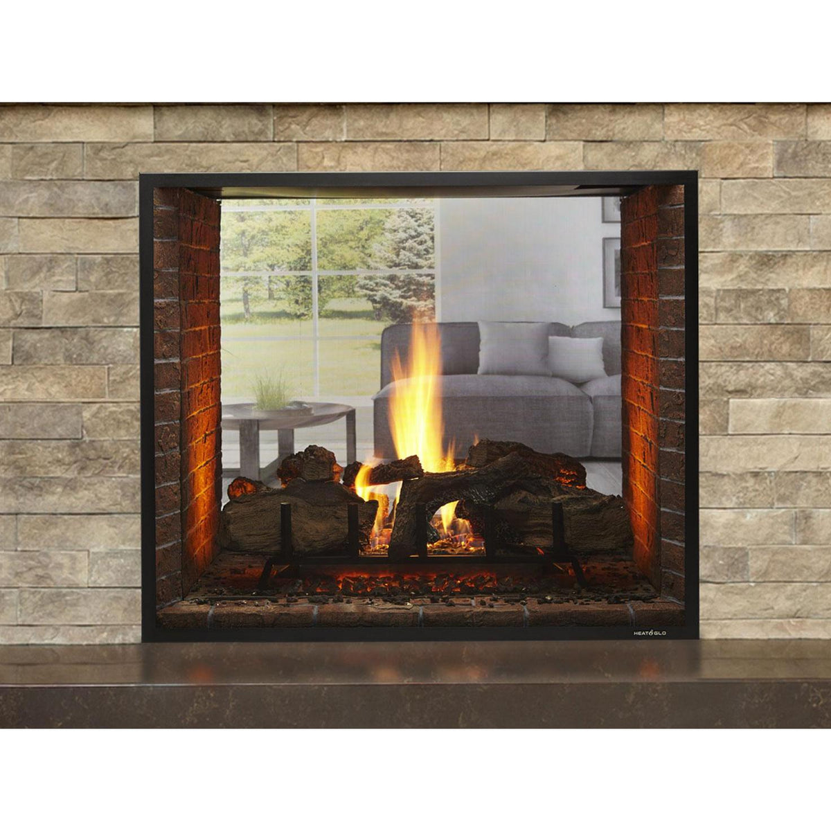 Heat & Glo Escape See-Through gas fireplace with natural logs, brick interior and fire screen. — official Escape See-Through Gas Fireplace series image; may show a different size and separately selected options