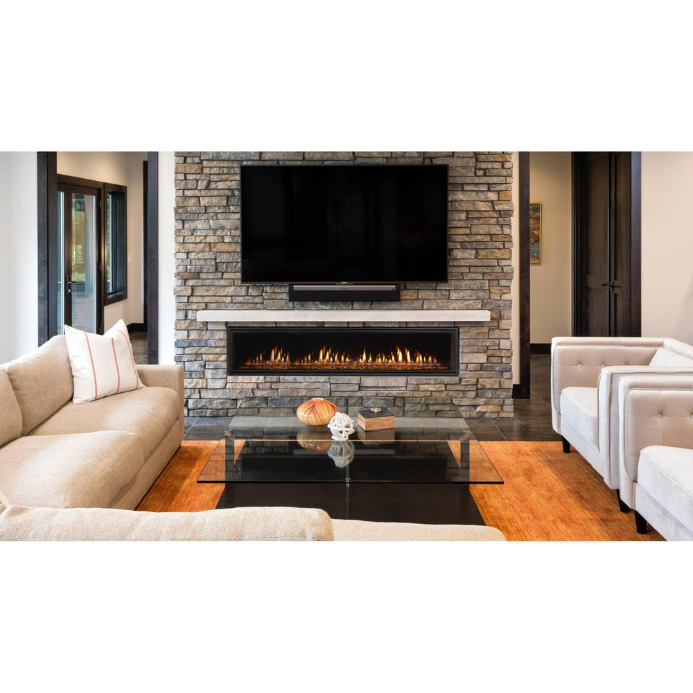Heat & Glo Mezzo AU linear modern indoor gas fireplace with ribbon flame and amber glass in living room with TV above. — official Mezzo Linear Indoor Gas Fireplace series image; may show a different size and separately selected options