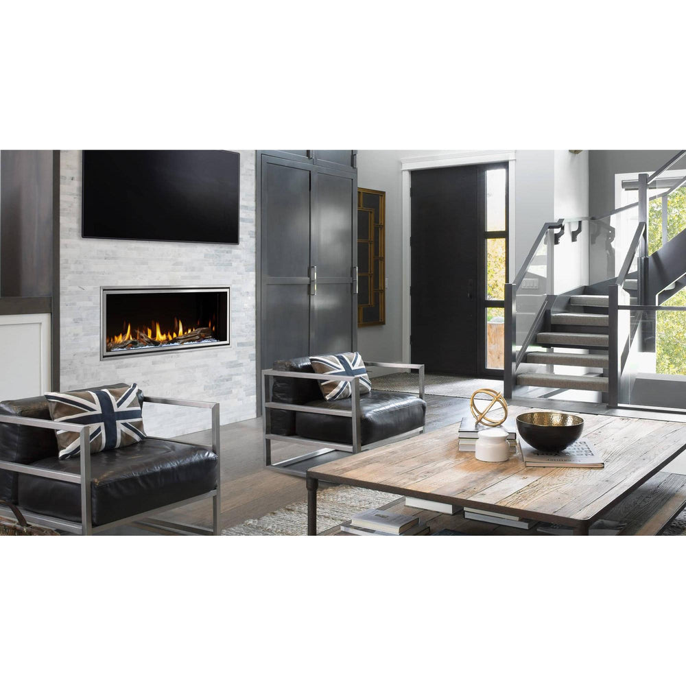 Heat & Glo Mezzo AU 36" linear modern indoor gas fireplace with driftwood logs in modern living room and TV above. — official Mezzo Linear Indoor Gas Fireplace series image; may show a different size and separately selected options
