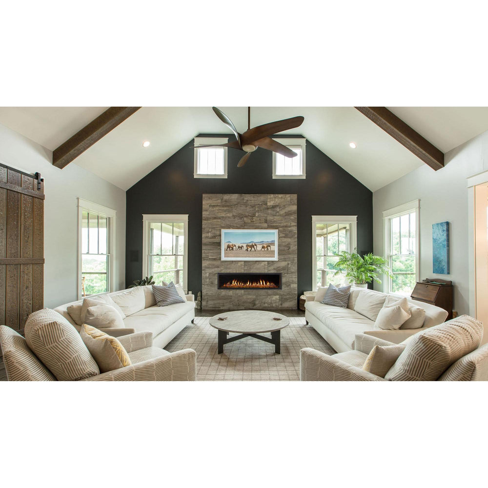 Heat & Glo Mezzo 36" linear modern indoor gas fireplace with ribbon flame and amber glass on stone wall in living room. — official Mezzo Linear Indoor Gas Fireplace series image; may show a different size and separately selected options