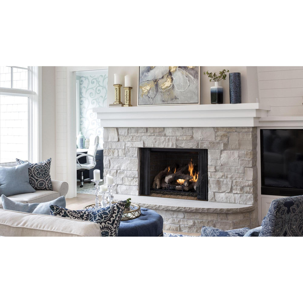 Heat & Glo Phoenix TrueView indoor gas fireplace with Stratford Brick interior in white stone hearth in living room. — official Phoenix TrueView Indoor Open Gas Fireplace series image; may show a different size and separately selected options