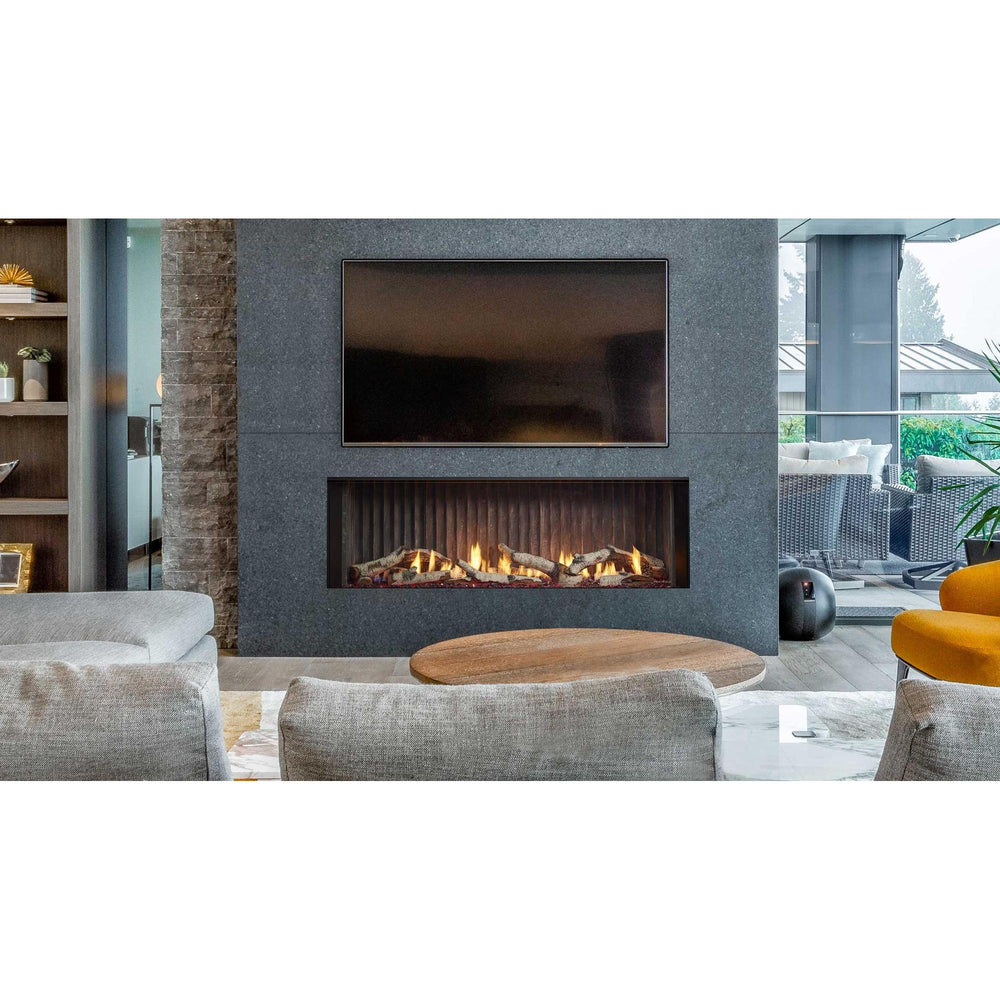 Open contemporary layout with angled stairs and L-shaped low-profile seating around linear fireplace wall with TV overhead. — official Primo II Linear Gas Fireplace series image; may show a different size and separately selected options