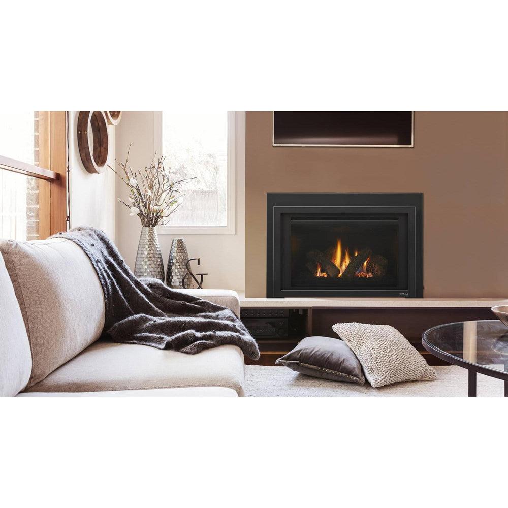 Heat & Glo Provident 35" gas fireplace insert with fire and glowing embers on tan wall in living room with TV overhead.. Official series image; size, front and optional finishes may differ from the quoted configuration.