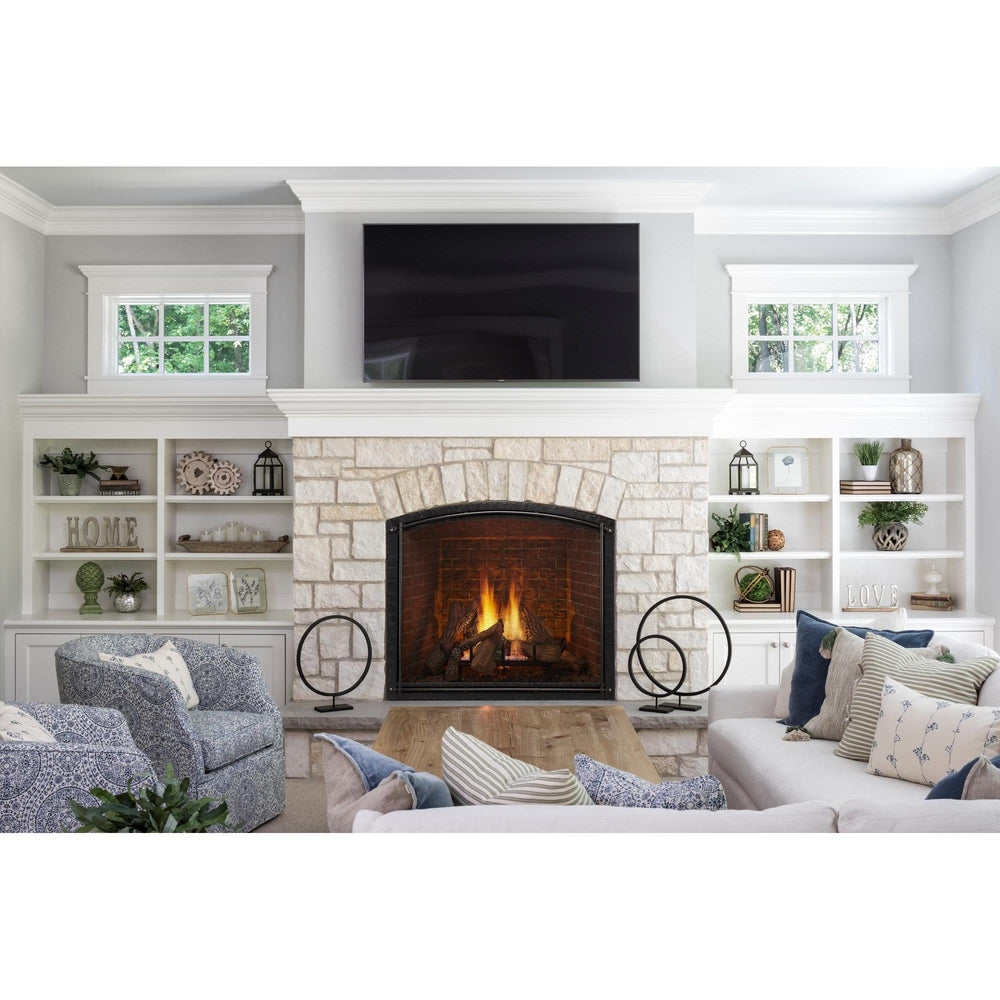 Coastal Chic furniture facing traditional fireplace in stone hearth with TV above and decorated shelves on each side. — official True Indoor Gas Fireplace series image; may show a different size and separately selected options