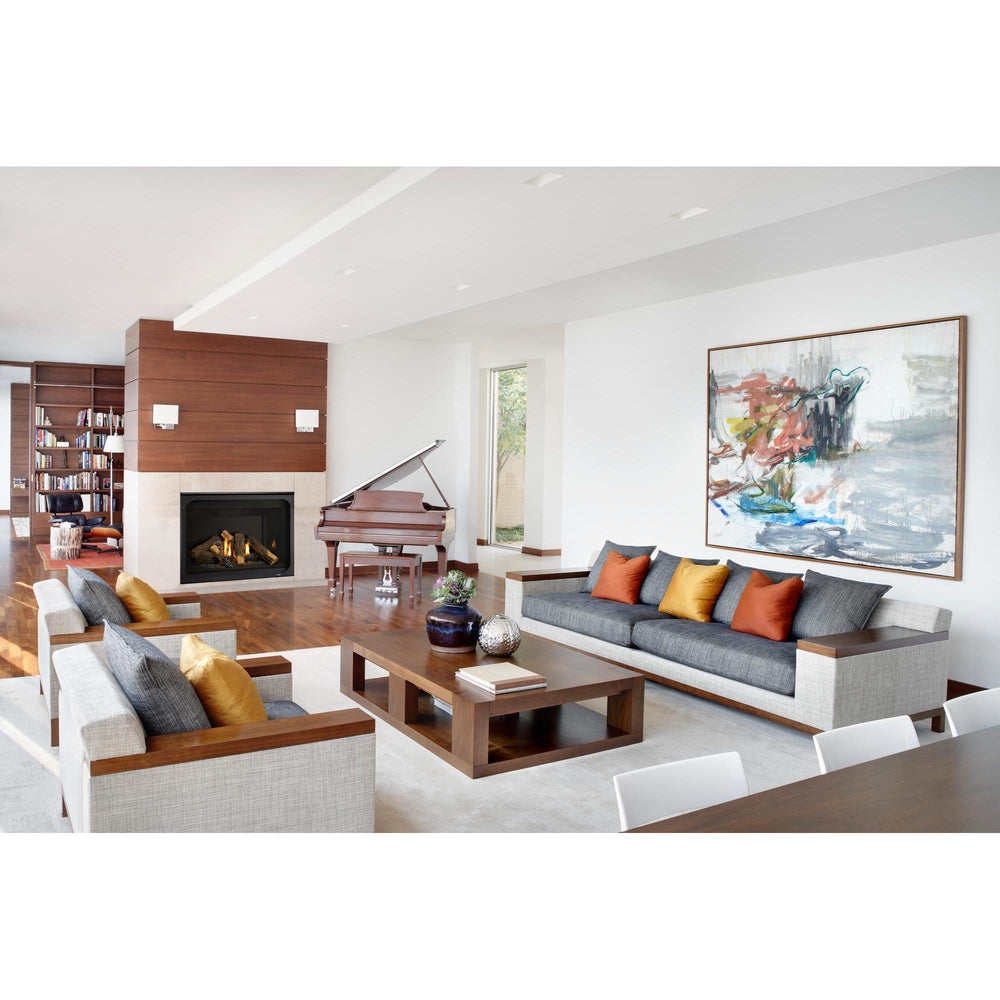 Contemporary living room with sofa, opposing chairs and grand piano has a partition wall with traditional gas fireplace. — official Caliber Gas Fireplace series image; may show a different size and separately selected options