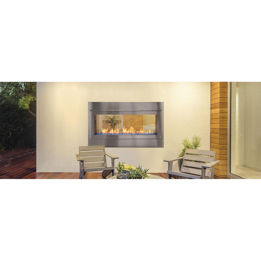 Artisan-48-in-See-Through-vent-free-gas-fireplace-in-stainless-steel-front-in-covered-porch-with-wooden-plank-floor. Manufacturer series illustration; shown size, accessories and room finishing may differ from the quoted configuration.