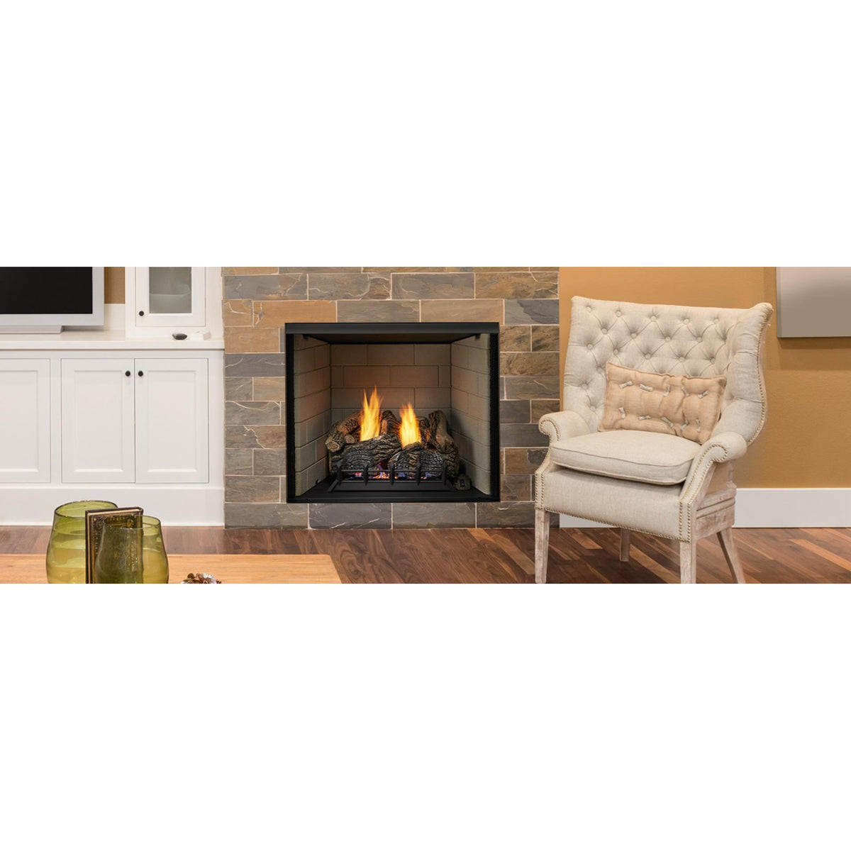 Exacta 32 series illustration: Exacta web imagOpen, airy floor plan with windows on one side, modern-traditional furnishings and stone floor-to-ceiling fireplace ; exact pictured size may differ, and gas logs, burner, accessories and finishes are separate.