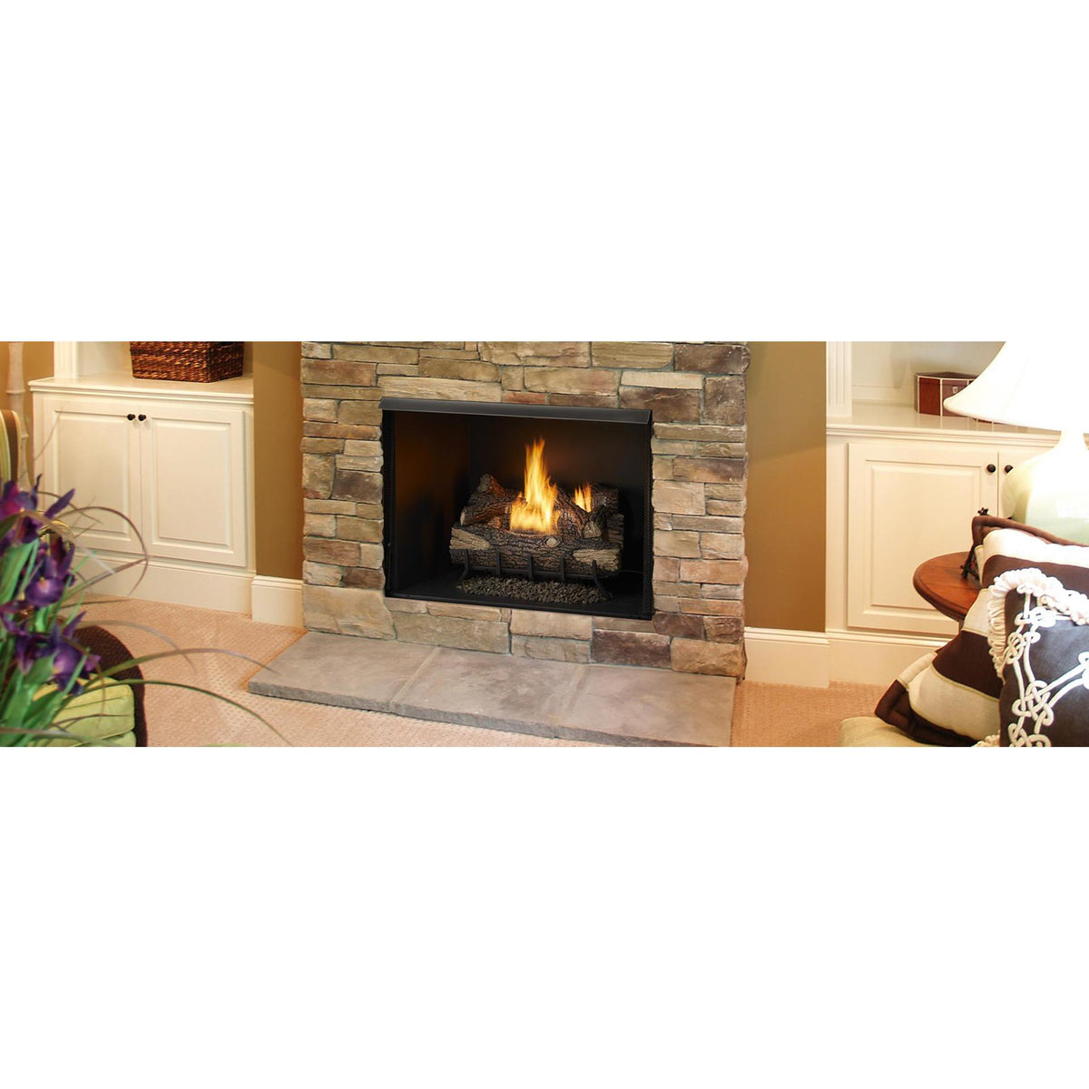 Exacta 36 series illustration: Traditional living room with stone fireplace and white wood mantel and rich harvest hues in furniture and wall colors; exact pictured size may differ, and gas logs, burner, accessories and finishes are separate.
