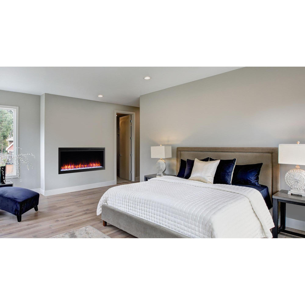 SimpliFire Allusion Platinum 50-inch linear electric fireplace with orange LED flames wall-mounted in master bedroom.; optional equipment and room finishes may be shown and are separate.