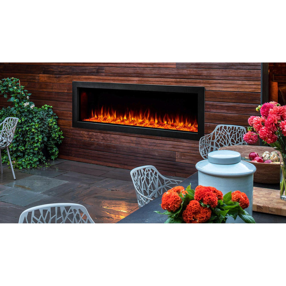SimpliFire Forum 55: Backyard garden and patio of luxury urban home with outdoor electric linear fireplace in wood-planked hearth wall. Optional logs and surrounding finishes may be shown.
