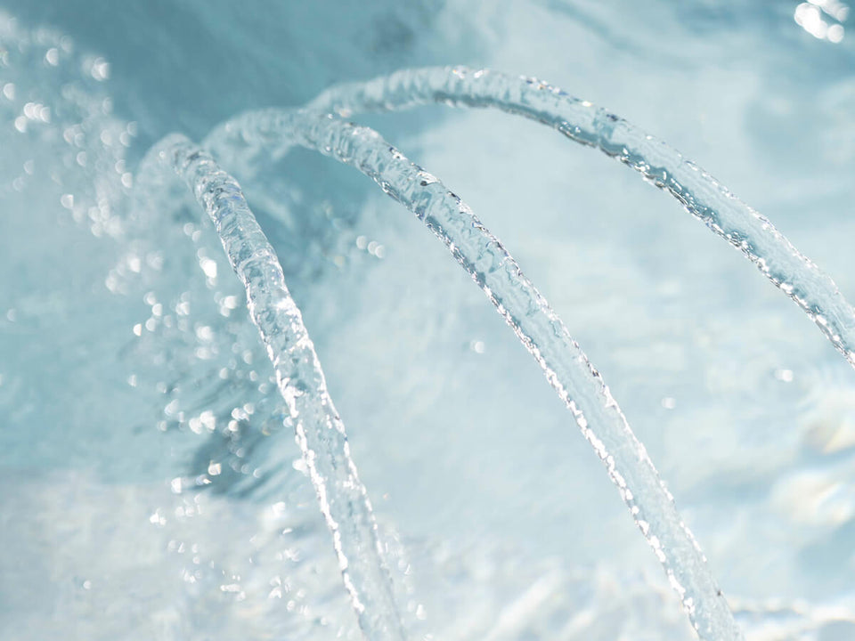 Clear blue spa water with sparkling water streams